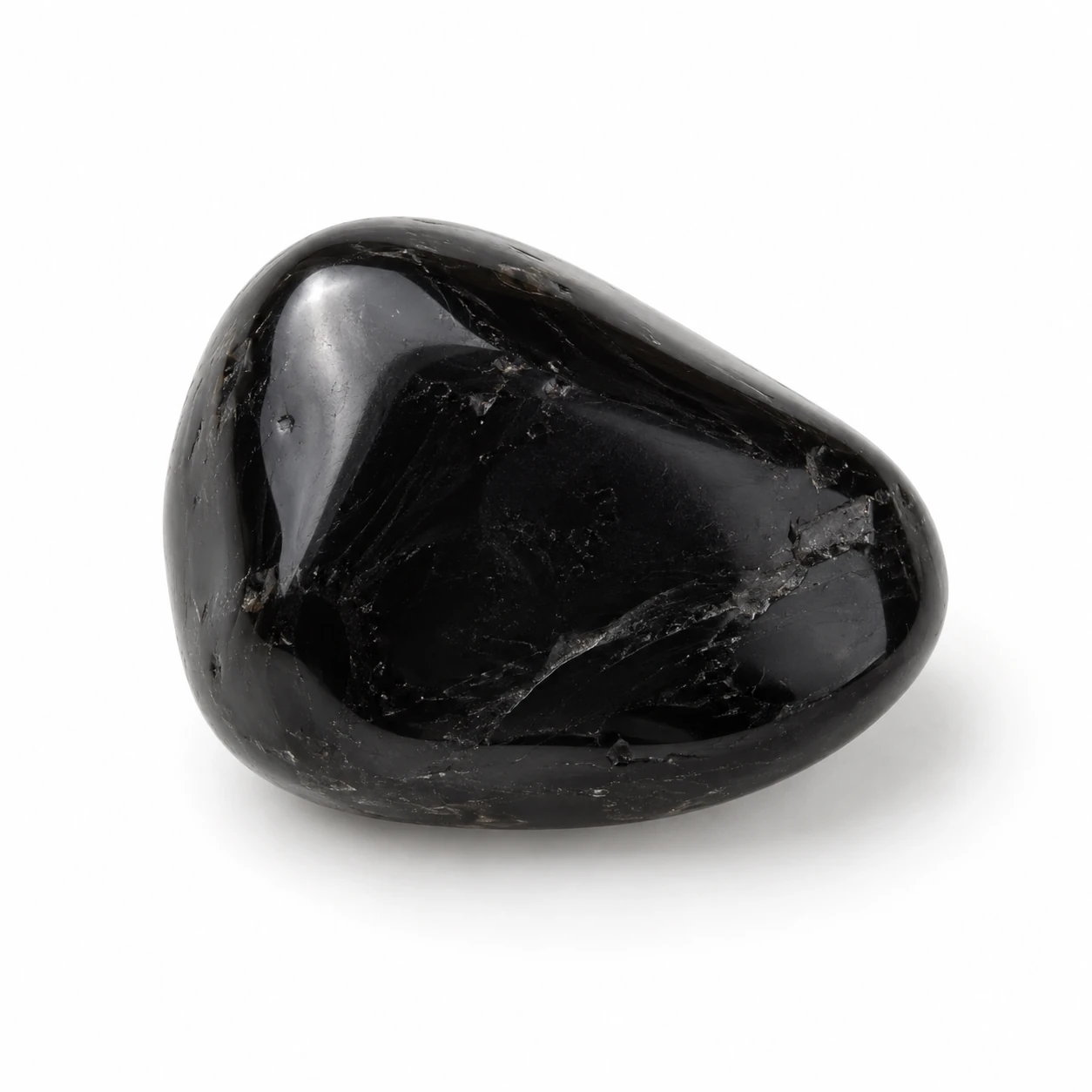 Diepzwart, glasachtig Zwarte obsidiaan edelsteen op een rustige neutrale achtergrond